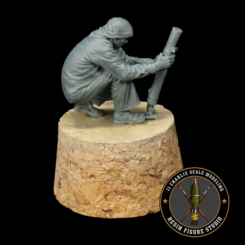 Single Unmasked Iraqi Civilian Holding 60mm Mortar Tube
